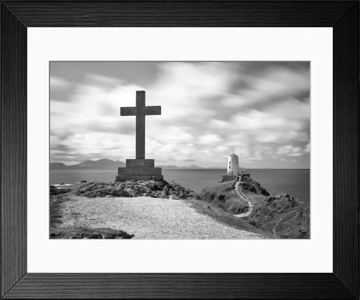 Framed Print : A cross and Twr Mawr lighthouse on Llanddwyn Island in Anglesey, Wales Framed Print : A cross and Twr Mawr lighthouse on Llanddwyn Island in Anglesey, Wales