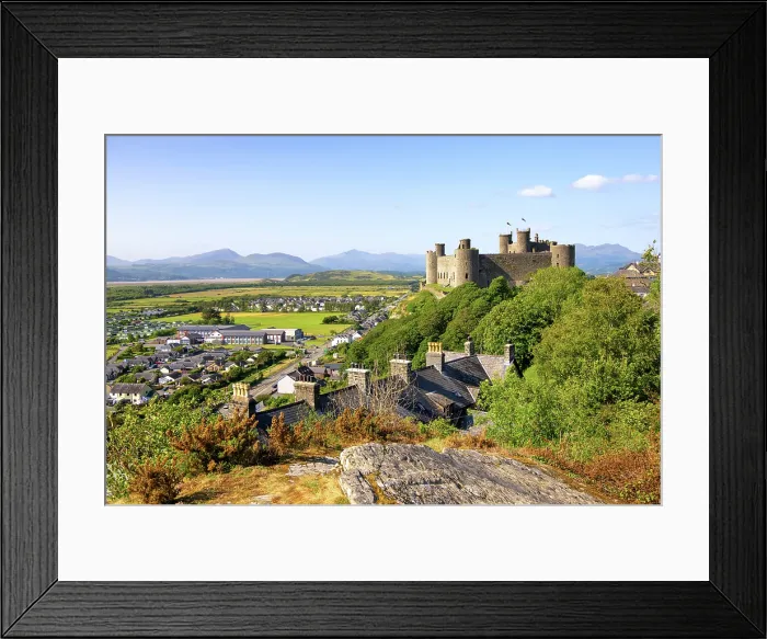 Framed Print : Views towards Harlech Castle (Castell Harlech) and village, with the mountain peaks of Eryri (Snowdonia) National Park in the background, Harlech, Gwynedd, Wales Framed Print : Views towards Harlech Castle (Castell Harlech) and village, with the mountain peaks of Eryri (Snowdonia) National Park in the background, Harlech, Gwynedd, Wales