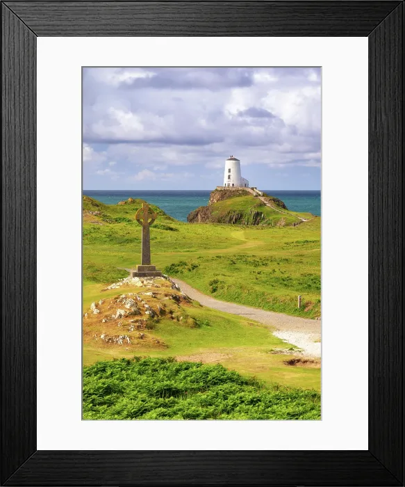 Framed Print : Celtic cross and Twr Mawr lighthouse on Llanddwyn Island in Anglesey, Wales Framed Print : Celtic cross and Twr Mawr lighthouse on Llanddwyn Island in Anglesey, Wales