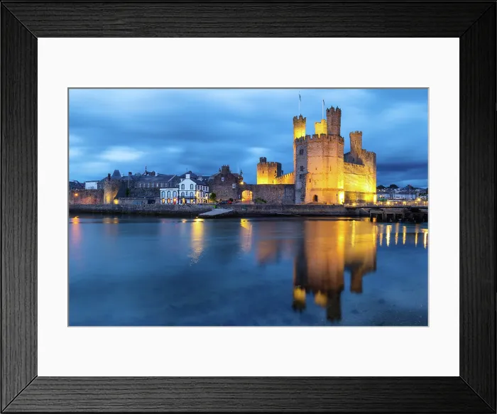 Framed Print : Caernarfon Castle (Castell Caernarfon) reflected in Afon Seiont at sunset, Caernarfon, Gwynedd, Wales Framed Print : Caernarfon Castle (Castell Caernarfon) reflected in Afon Seiont at sunset, Caernarfon, Gwynedd, Wales