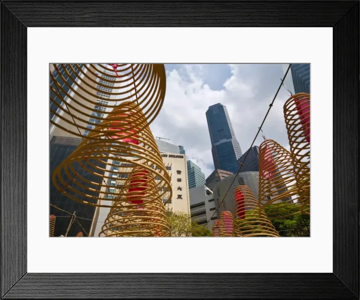 Framed Print : Singapore, Singapore, Raffles Place. Spiral incense coils with city skyline in background at Wak Hai Cheng Framed Print : Singapore, Singapore, Raffles Place. Spiral incense coils with city skyline in background at Wak Hai Cheng