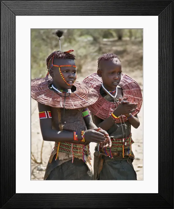 Framed Print : Two young Pokot girls wearing traditional ornaments that denote their unmarried status Framed Print : Two young Pokot girls wearing traditional ornaments that denote their unmarried status