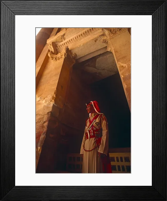 Framed Print : Jordan, Petra. A Jordanian policeman stands at the entrance to Petras famous Treasury Framed Print : Jordan, Petra. A Jordanian policeman stands at the entrance to Petras famous Treasury