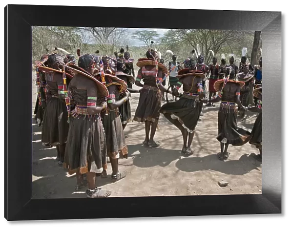 Pokot men and women dancing to celebrate an Atelo ceremony. The Pokot are pastoralists speaking a Southern
