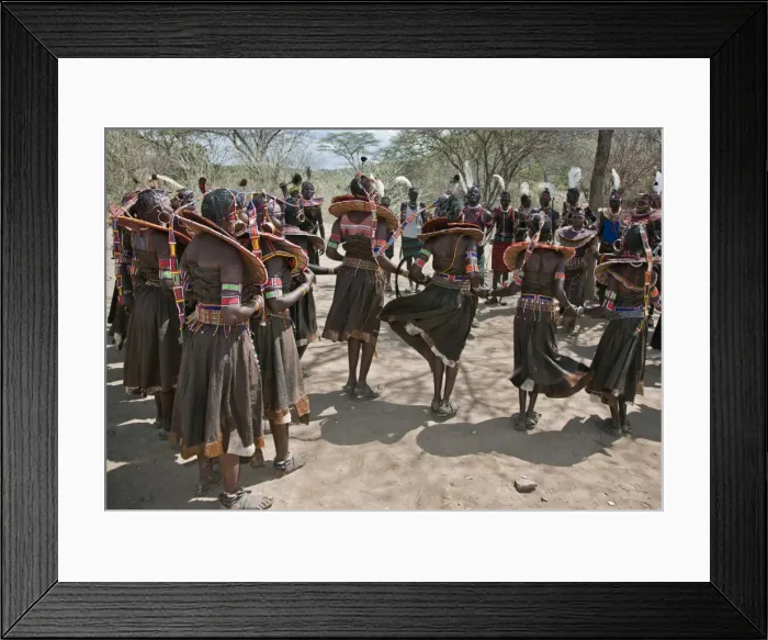 Framed Print : Pokot men and women dancing to celebrate an Atelo ceremony. The Pokot are pastoralists speaking a Southern Framed Print : Pokot men and women dancing to celebrate an Atelo ceremony. The Pokot are pastoralists speaking a Southern