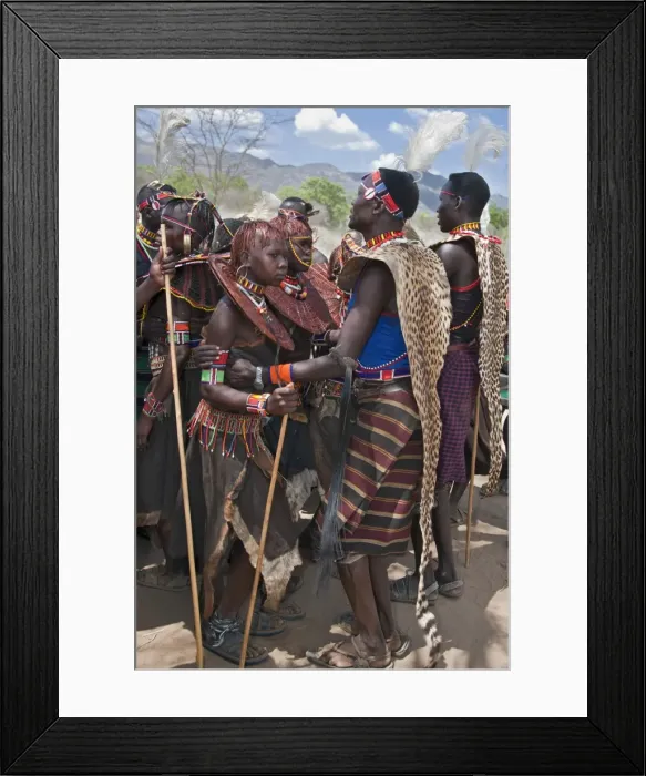 Framed Print : Pokot men, women and girls dancing to celebrate an Atelo ceremony. The Pokot are pastoralists speaking a Southern Framed Print : Pokot men, women and girls dancing to celebrate an Atelo ceremony. The Pokot are pastoralists speaking a Southern