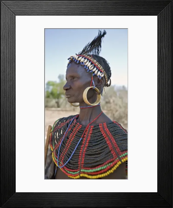 Framed Print : A striking old Pokot woman wearing the traditional beaded ornaments of her tribe which denote her married status. The Pokot are pastoralists speaking a Southern Framed Print : A striking old Pokot woman wearing the traditional beaded ornaments of her tribe which denote her married status. The Pokot are pastoralists speaking a Southern