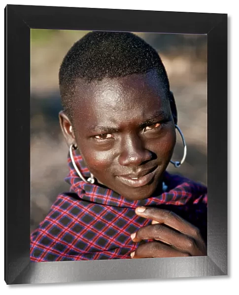 A young Pokot warrior with large round earrings. The Pokot are pastoralists speaking a Southern Nilotic