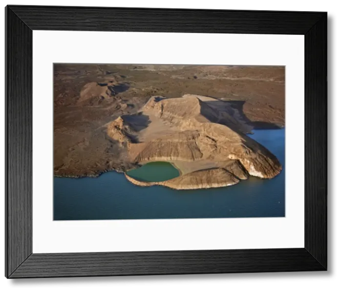 Framed Print : An extinct volcanic crater, Abil Agituk, at the southern end of Lake Turkana has a distinctively green crater lake which is fed by underground seepage from Framed Print : An extinct volcanic crater, Abil Agituk, at the southern end of Lake Turkana has a distinctively green crater lake which is fed by underground seepage from