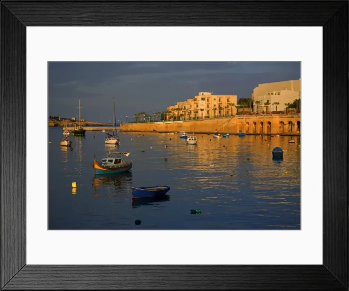 Framed Print : Malta, Europe; Colourful traditional wooden boats in the placid bay of the former fishing village Framed Print : Malta, Europe; Colourful traditional wooden boats in the placid bay of the former fishing village