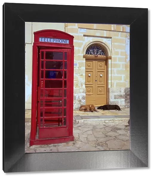 Malta, Marsaxlokk, Europe; Reminiscent of a bygone era, the island is still full of telephone boxes dating back to the