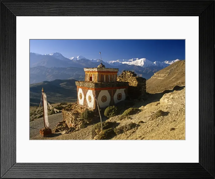 Framed Print : Nepal, Himalaya, Mustang. A decorative chorten, or Buddhist shrine, known as Chhyungkar guards the trail near Syangboche hamlet and the Syangboche Pass while the massive Annapurna massif frames