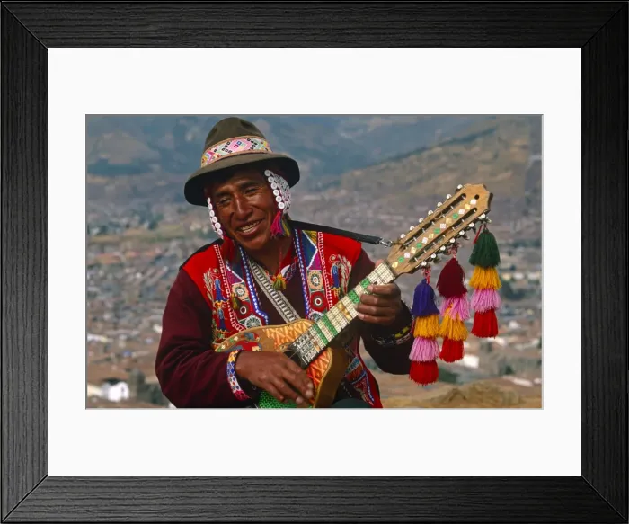 Framed Print : Peru, Cusco. An itinerant Quechuan musician plays his bandurria in the hills above Cusco Framed Print : Peru, Cusco. An itinerant Quechuan musician plays his bandurria in the hills above Cusco