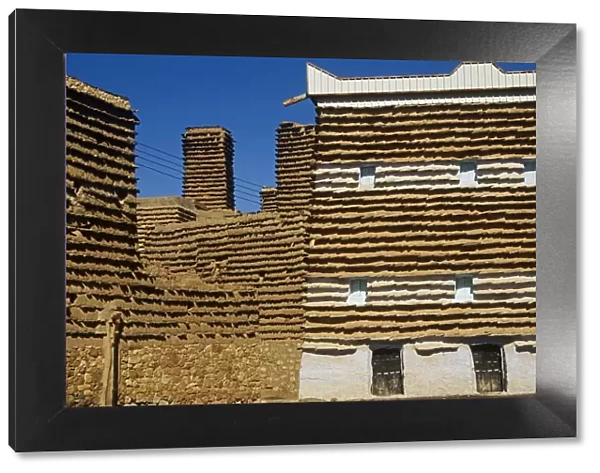 Saudi Arabia, Asir, Al-Alkhalaf. The village of Al-Alkhalaf is among the finest examples of the regions traditional forms of architecture (sometimes called raqaf) with tower-like houses with adobe walls (khulb) protected from erosion