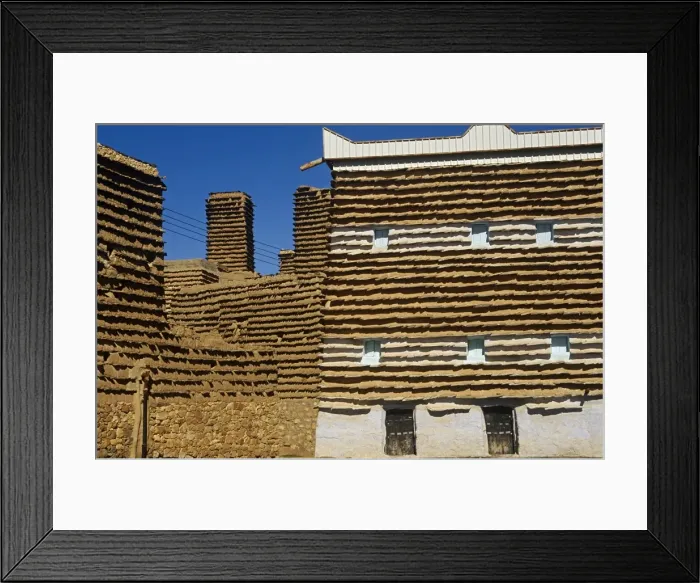 Framed Print : Saudi Arabia, Asir, Al-Alkhalaf. The village of Al-Alkhalaf is among the finest examples of the regions traditional forms of architecture (sometimes called raqaf) with tower-like houses with adobe walls (khulb) protected from erosion Framed Print : Saudi Arabia, Asir, Al-Alkhalaf. The village of Al-Alkhalaf is among the finest examples of the regions traditional forms of architecture (sometimes called raqaf) with tower-like houses with adobe walls (khulb) protected from erosion