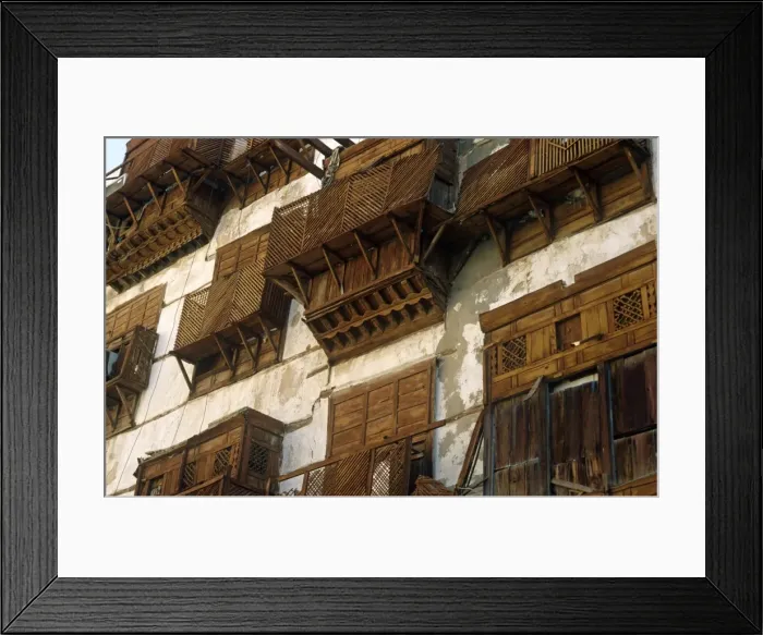 Framed Print : Saudi Arabia, Makkah, Jeddah. Al-Balad, the historic heart of Jeddah, still contains some 19th-century buildings with their distinctive mashrabiyas (Arab oriel windows) - wooden latticework screening windows and supporting small