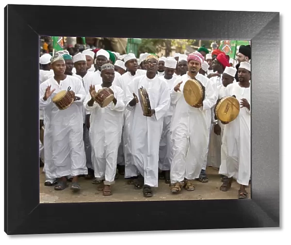 Kenya. A joyful Muslim procession during Maulidi, the celebration of Prophet Mohammeds birthday