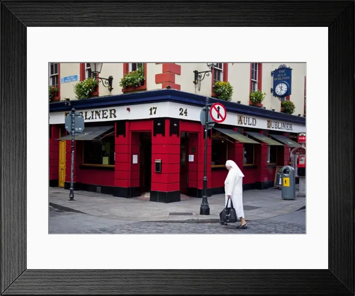 Framed Print : Pub in Temple Bar district in Dublin, Ireland. Auld Dubliner in the area on the south bank of the River Liffey in Framed Print : Pub in Temple Bar district in Dublin, Ireland. Auld Dubliner in the area on the south bank of the River Liffey in