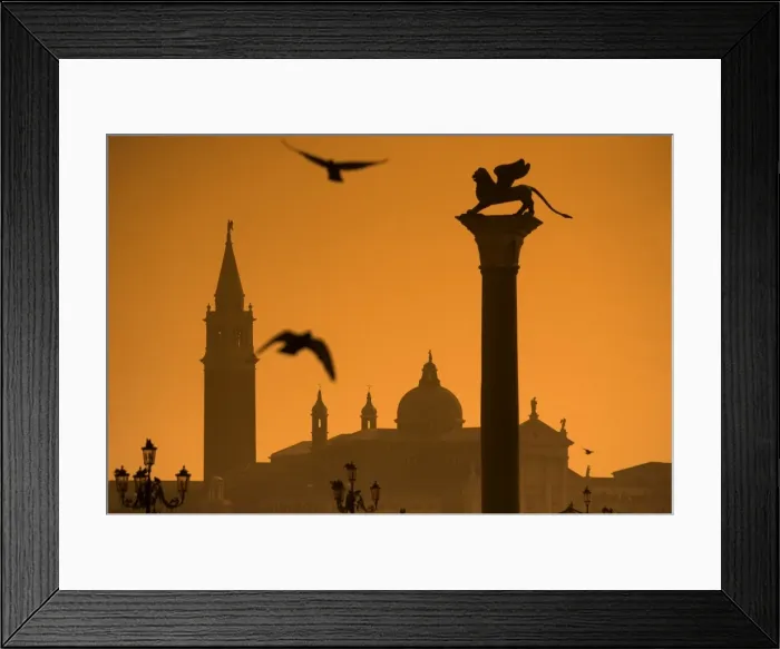 Framed Print : Italy, Veneto, Venice; San Giorgio Maggiore in the background with the lion of Venice in the foreground, seen from Piazza Framed Print : Italy, Veneto, Venice; San Giorgio Maggiore in the background with the lion of Venice in the foreground, seen from Piazza
