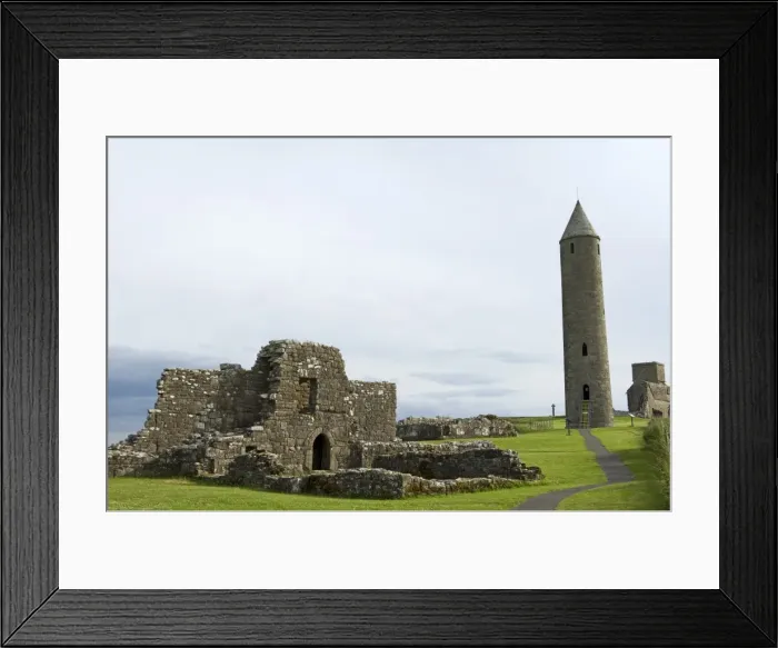 Framed Print : Northern Ireland, Fermanagh, Enniskillen. Tthe monastic settlement and round tower on Devenish Island in Lower Framed Print : Northern Ireland, Fermanagh, Enniskillen. Tthe monastic settlement and round tower on Devenish Island in Lower