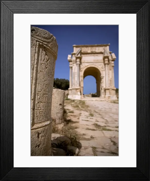 Framed Print : Libya; Tripolitania; Khums; An inscription on a stone and the Arch of Septimius Severus