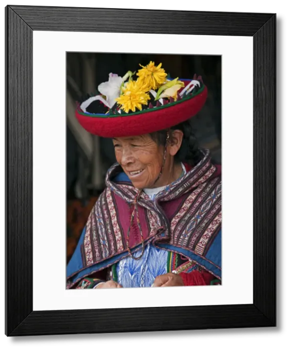 Framed Print : Peru, An old woman in traditional Indian costume with her round, saucer-shaped hat decorated with fresh Framed Print : Peru, An old woman in traditional Indian costume with her round, saucer-shaped hat decorated with fresh