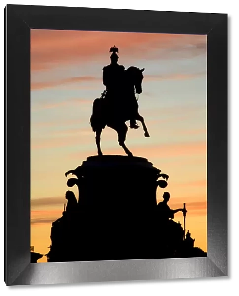 Russia, St. Petersburg; Silhoutte of Tsar Nicholas I monument against a dramatic evening light in