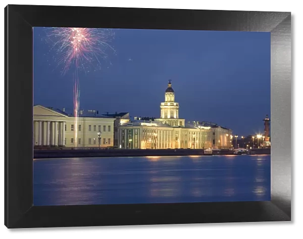 Russia, St. Petersburg; Across the Neva River with the Kunstkamera and a Rostral column while fireworks are