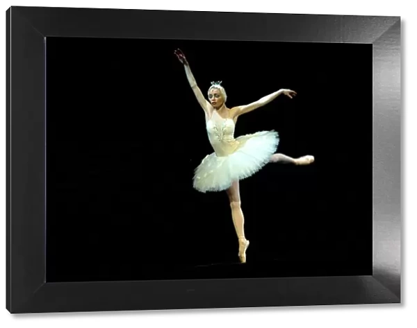 Russia, St. Petersburg; The Prima Ballerina playing the Swan Princess Odette during a solo in Tchaikovsky s