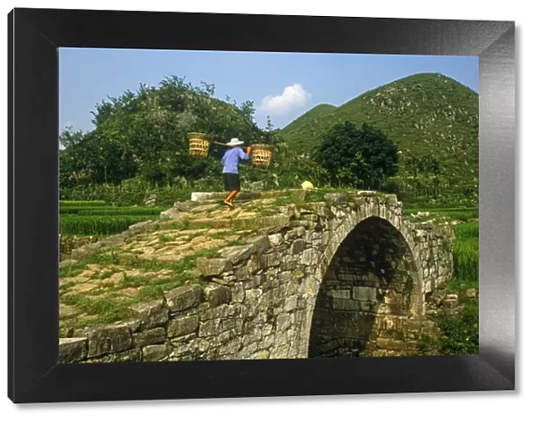 China, Guizhou Province, nr. Huangguoshu Falls. Stone-built humpbacked bridges are common in Bouyi