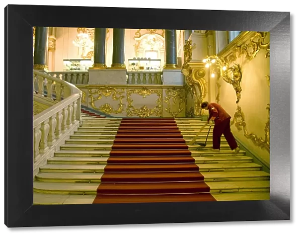 Russia, St. Petersburg; A worker inside the state Hermitage Museum