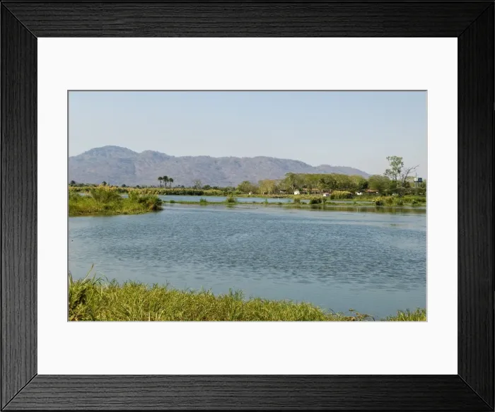 Framed Print : Malawi, Liwonde. View downstream along the Shire River from the barrage near Liwonde Framed Print : Malawi, Liwonde. View downstream along the Shire River from the barrage near Liwonde