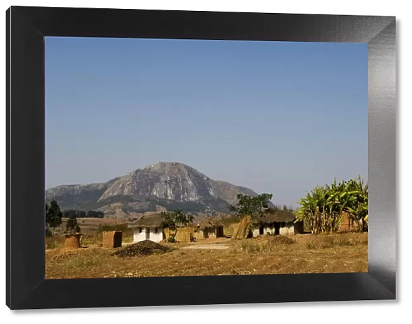 Malawi, Dedza. Grass-roofed houses in a rural village in the Dedza region