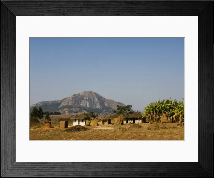 Framed Print : Malawi, Dedza. Grass-roofed houses in a rural village in the Dedza region Framed Print : Malawi, Dedza. Grass-roofed houses in a rural village in the Dedza region