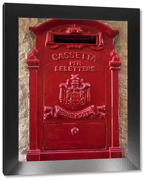 Malta, Europe; A coloured letter box, normally found in village or town cores complimenting colourful doors
