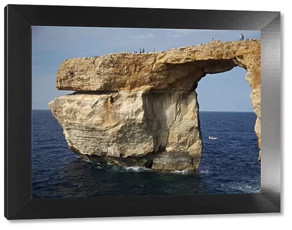 Gozo, Malta, Europe; A natural arch formed in rock called the Azure Window found in Dwejra, which served as the backdrop to some Hollywood blockbuster and international