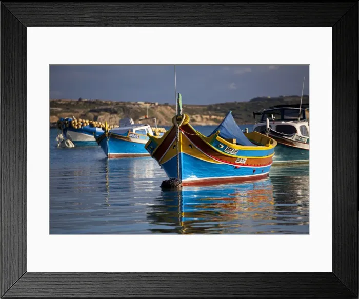 Framed Print : Malta, Europe; Colourful traditional Maltese boats known locally as luzzu in the village of Marsaxlokk which is still based around the fishing industry. The boats have two eyes in the bow which according to legend might represent those Framed Print : Malta, Europe; Colourful traditional Maltese boats known locally as luzzu in the village of Marsaxlokk which is still based around the fishing industry. The boats have two eyes in the bow which according to legend might represent those