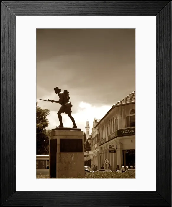 Framed Print : Tanzania, Dar es Salaam. The Askari Monument stands in the middle of a busy roundabout Framed Print : Tanzania, Dar es Salaam. The Askari Monument stands in the middle of a busy roundabout