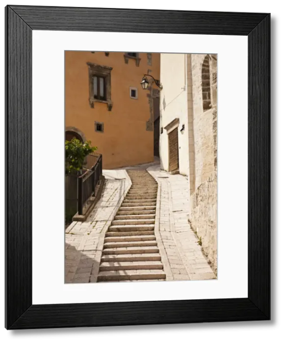 Framed Print : Italy, Umbria, Preci. A narrow street in Preci, known throughout Europe in the sixteenth century for its school for surgeons, founded by Benedictine monks, their main trade being the removal of kidney stones, eye surgery