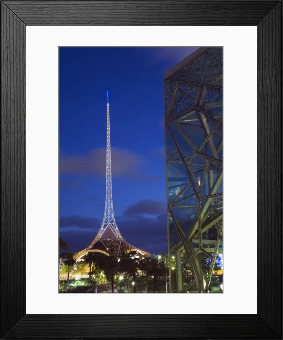 Framed Print : Australia, Victoria, Melbourne. Glass and steel architecture of Federation Square with the spire of the Theatres Framed Print : Australia, Victoria, Melbourne. Glass and steel architecture of Federation Square with the spire of the Theatres