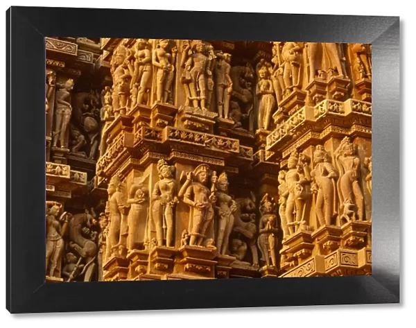India, Madhya Pradesh, Khajuraho. The Kandariya Mahadeva Temple at Khajuraho is one of several celebrated Hindu temples famed their exuberant sculpture. Khajurahos temples are now a UNESCO World
