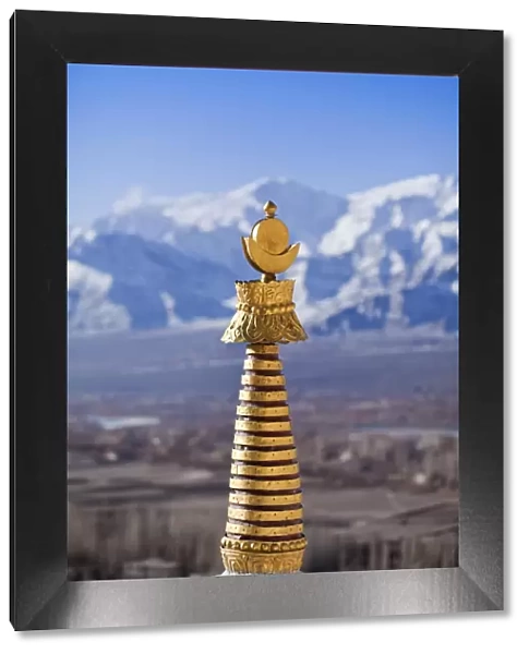 India, Ladakh, Thiksey. The golden finial of a chorten at Thiksey Monastery
