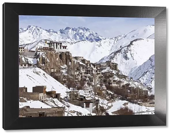 India, Ladakh, Lamayuru. Lamayuru Monastery, remote and isolated, hemmed in by dramatic snow covered