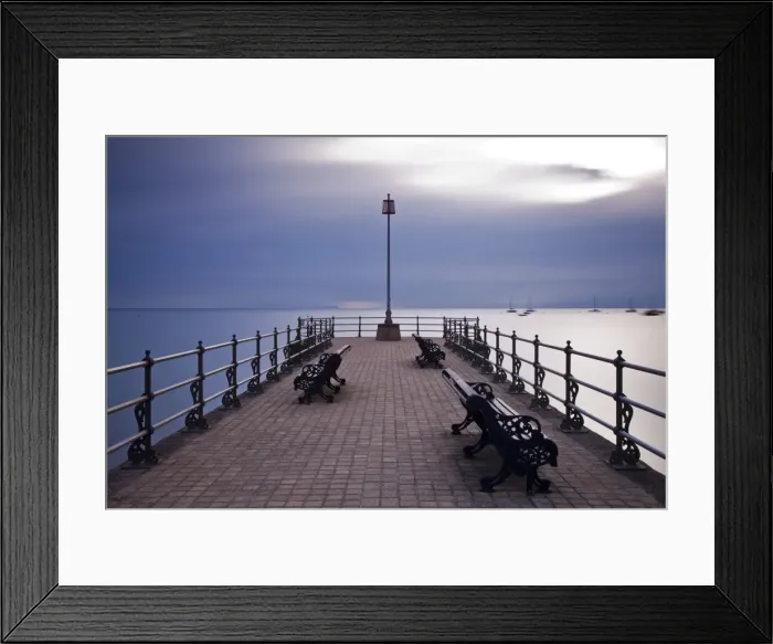 Framed Print : England, Dorset, Swanage. Sunrise from the Banjo Jetty at Swanage, with the Isle of Wight just visible on