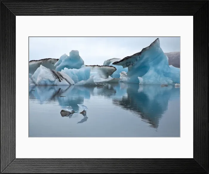 Framed Print : Large blocks of ice floating on Jokulsarlon lagoon. These blocks break off from the 30-metres-high edge of the Breidamerkurjokull glacier, keeping the deep lagoon always stocked with amazing Framed Print : Large blocks of ice floating on Jokulsarlon lagoon. These blocks break off from the 30-metres-high edge of the Breidamerkurjokull glacier, keeping the deep lagoon always stocked with amazing