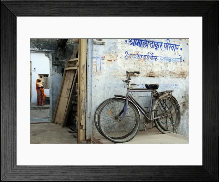 Framed Print : India, Rajasthan, Narlai. Bikes rest outside the doors of a traditional house in the remote village of Framed Print : India, Rajasthan, Narlai. Bikes rest outside the doors of a traditional house in the remote village of