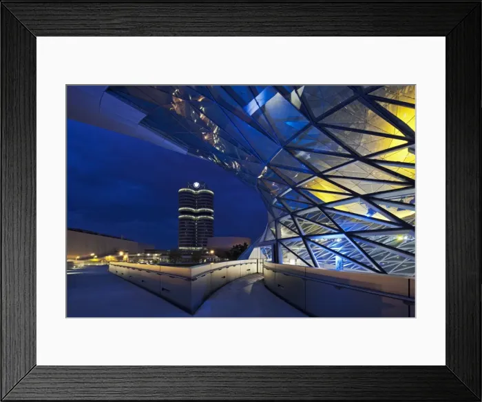 Framed Print : Twilight view of the pedestrian bridge link to the BMW Headquarters Office building Framed Print : Twilight view of the pedestrian bridge link to the BMW Headquarters Office building