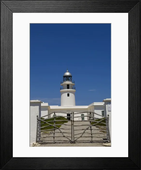 Framed Print : Spain, Menorca, Cap de Cavalleria. Lighthhouse at Cap de Cavalleria looks out over the Mediterranean from Menorcas rugged Framed Print : Spain, Menorca, Cap de Cavalleria. Lighthhouse at Cap de Cavalleria looks out over the Mediterranean from Menorcas rugged
