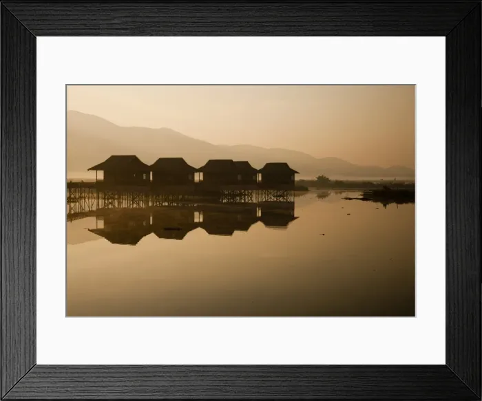 Framed Print : Myanmar, Inle Lake. A misty dawn at Golden Island Cottages, a resort for tourists owned by the Pa-O people, a collection of comfortable wooden huts on stilts