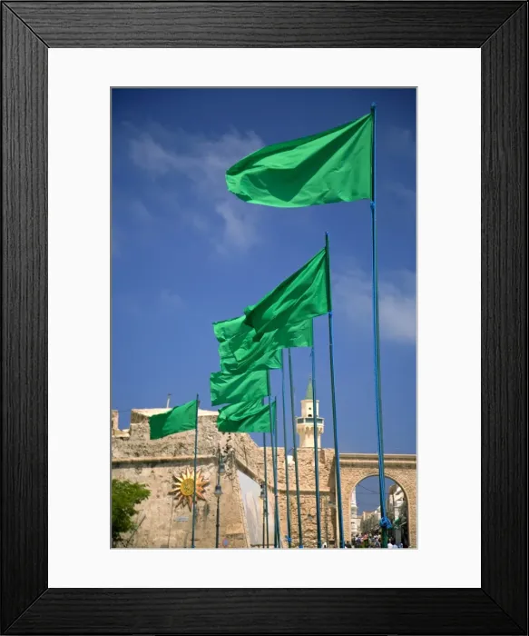 Framed Print : Tripoli, Libya; Libyan flags prominently displayed on Green Square in front of the entrance to the old Medina Framed Print : Tripoli, Libya; Libyan flags prominently displayed on Green Square in front of the entrance to the old Medina